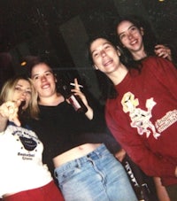 a group of girls posing for a picture at a party